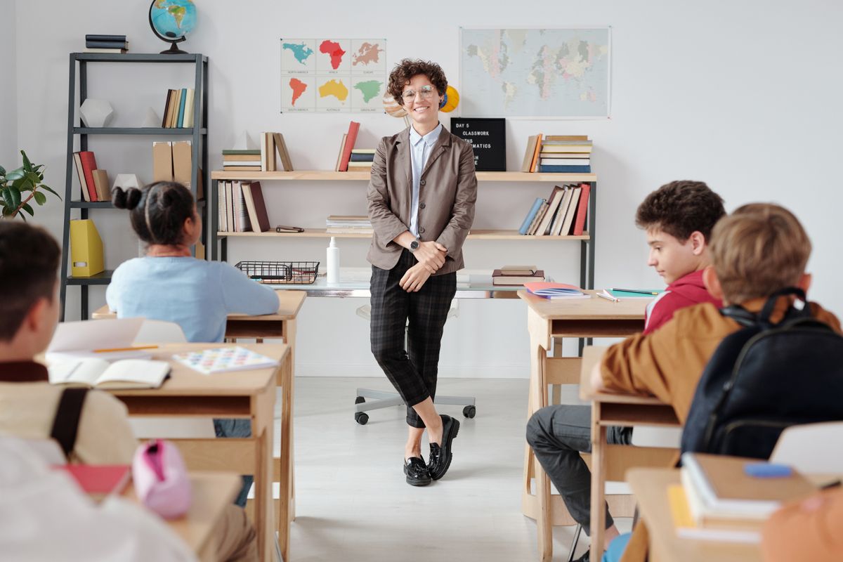 A teacher leading a lesson with students in a classroom