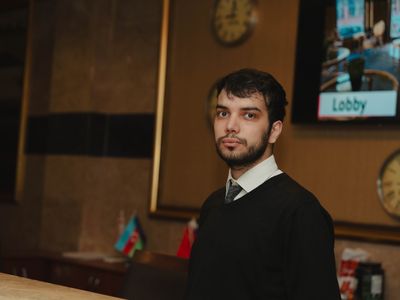 A hotel receptionist at the front desk