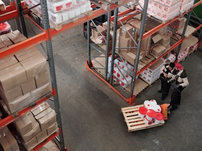 Warehouse employees organising stock